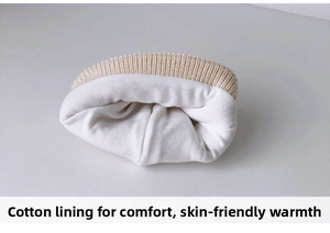 Detail of baby knit hat with soft cotton lining for warmth and skin-friendly comfort