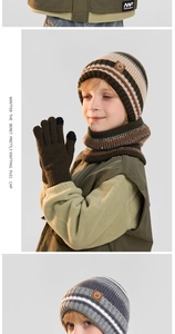 Close-up of kids winter knit set showing striped texture and faux leather mountain patch