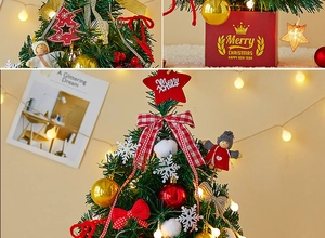 Close-up of mini Christmas tree with warm LED lights, gold ornaments, and gift box base