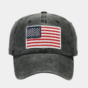 Detailed embroidery of American flag on vintage washed cotton baseball cap texture