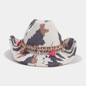 Ethnic style cow print western cowboy hat with colorful tassels and shell decorations