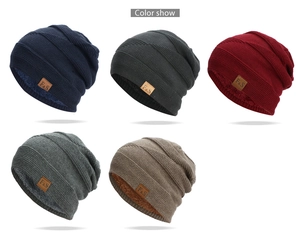 Detail showing knit beanies in five colors with thick fleece lining and leather F&S logo