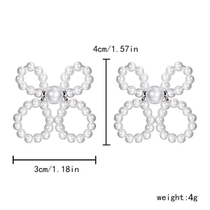 Detail view of pearl bow earrings with precise size 4cm and weight 4g measurements