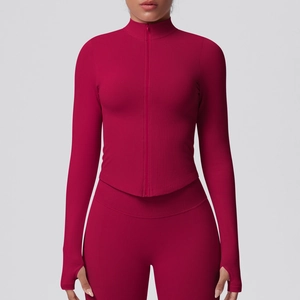 Detail of red athletic jacket with stand collar zipper and thumbhole cuffs on sleeve