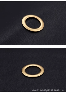 Macro shot of 18K gold plated matte rings on black leather for DIY jewelry making