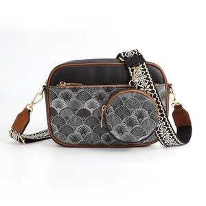 Detail of checkered crossbody camera bag with round coin purse and woven strap