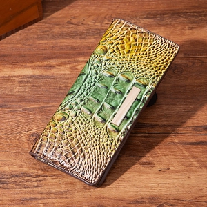 Retro crocodile pattern long wallet with green and tan gradient on dark wooden surface