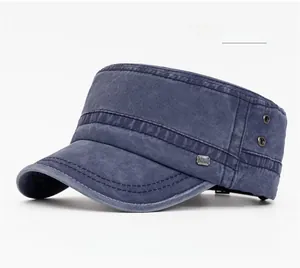 Detail view of navy blue cotton flat top cap with metal eyelets and a NEW metal plate