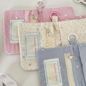 Detailed flat lay of pink, cream, and blue glitter star sequin card purses with hooks