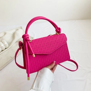 Chic fuchsia woven shoulder bag with knotted handle and slim crossbody strap