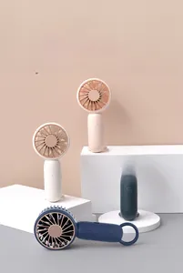 Variety of portable mini USB fans in four colors displayed on geometric podiums