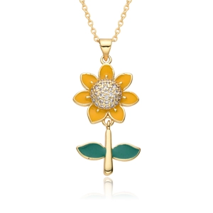Luxurious sunflower pendant necklace with zircon crystals and gold chain on white surface