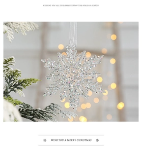 Clear acrylic snowflake ornament with sparkling glitter and silver ribbon for Christmas