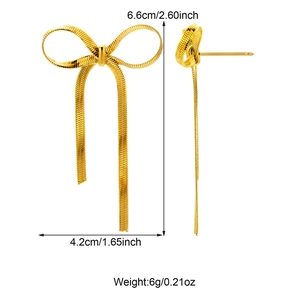 Detailed size view of gold bow tassel earrings with dimensions 6.6cm by 4.2cm on white