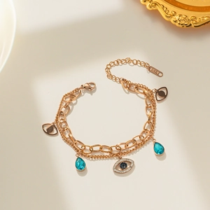 Bracelet double couche œil protecteur doré avec pierres bleues et poinçon K18