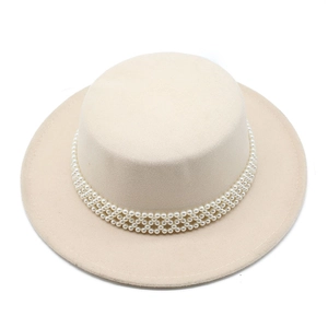 Macro detail of luxury cream wool boater hat with intricate white pearl woven band decor