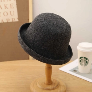 Elegant dark grey wool felt bowler hat with round crown and rolled brim for women