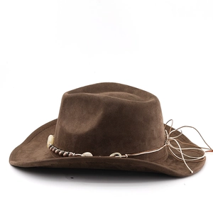Detail of bohemian brown suede cowboy hat with shell and bead woven band decoration