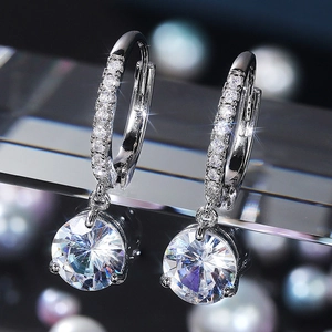 Exquisite silver drop earrings featuring round-cut zircons and brilliant pavé accents