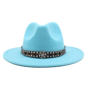 Detail of wool jazz hat featuring a brown leather band with rivets and metal buckle