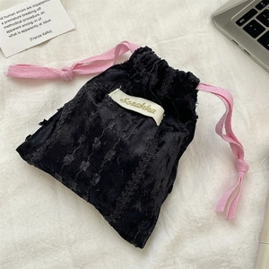 Black velvet drawstring storage pouch with pink ribbon tie for lipstick and accessories