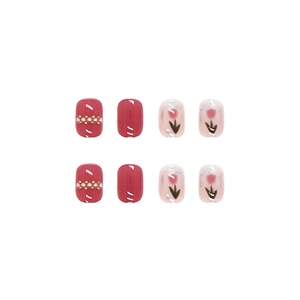 Pink blush press-on nails with pearls, tulip floral designs and glossy short round finish