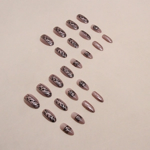 Almond press-on nails with champagne glitter and black animal print pattern set