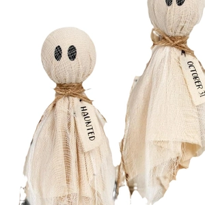 Handcrafted Halloween ghost figurines with gauze texture and October 31 haunted tags