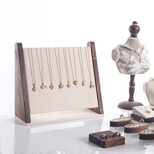 Walnut wood jewelry display set with necklace stands, ring holders and bust mannequin