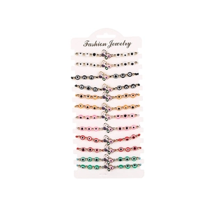 Set of 12 colorful beaded butterfly bracelets with evil eye motifs and crystal accents