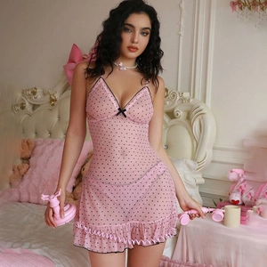 Detailed view of pink polka dot mesh nightwear with black lace trim and bow accent