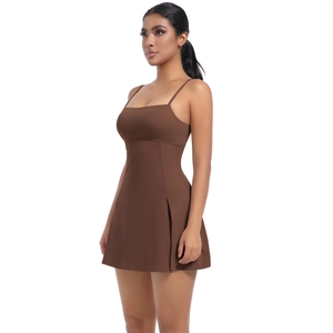 Detail view of coffee brown sports dress featuring side slit and slim fit athletic fabric