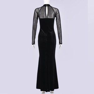 Detail view of the velvet and mesh patchwork on a fitted black long sleeve dress