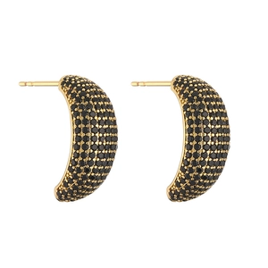 Detailed view of crescent moon stud earrings with black pavé crystals in gold setting