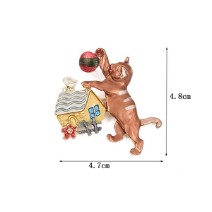 Detailed view of enamel cat brooch with size measurements 4.8cm height and 4.7cm width