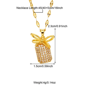 Detailed view of gold bow pendant necklace with dimensions 2.3x1.5cm and 45cm chain length