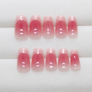 Pink gradient press-on nails with white lace patterns and square-oval shape