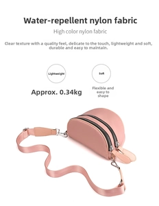 Detail of pink waterproof nylon shoulder bag featuring dual zippers and 0.34kg lightweight design
