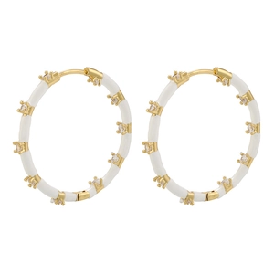 Golden hoop earrings with white enamel segments and sparkling cubic zirconia stones
