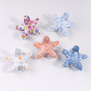 Set of 5 starfish-shaped hair claw clips with colorful smiley faces and nautical patterns