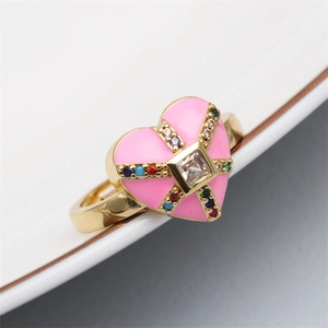 Macro detail of adjustable heart ring with enamel and colorful zircon stones inlay