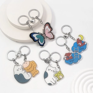 Close-up of acrylic keychains featuring cute animals and heart-shaped magnetic connectors