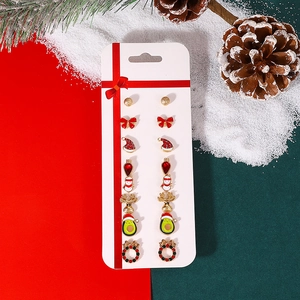Christmas stud earring set featuring reindeer and snowman designs on festive background