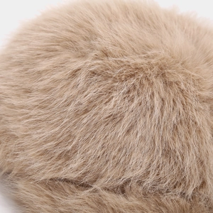 Macro shot of soft faux fox fur on a warm winter baseball cap showing thick plush texture