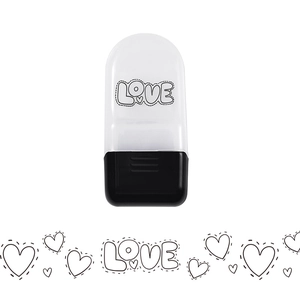 Detail of cartoon rolling stamp tool with LOVE heart pattern for DIY journaling