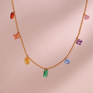 Close-up of 18K gold plated necklace with colorful zircon pendants in various shapes
