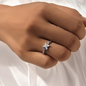 Detail of S925 silver ring featuring white marquise stones and purple crystal flower petals