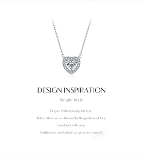Close-up of S925 silver necklace with sparkling heart pendant and moissanite inlay