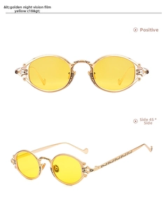 Macro view of gold metal steampunk sunglasses with yellow lenses and baroque engraving