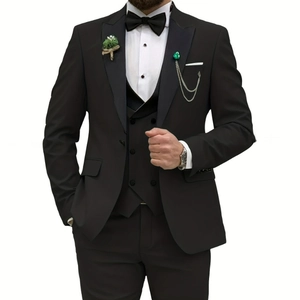 Detail of slim fit three-piece suit with peak lapel, double-breasted vest and brooch